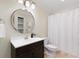 This bright bathroom features a stylish vanity and a full tub at 3966 Creekview Ridge Dr, Buford, GA 30518