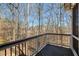 Wooden deck with a view of the surrounding trees at 3966 Creekview Ridge Dr, Buford, GA 30518