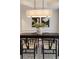 Close up of a formal dining room with wainscoting, a modern light fixture, and a vase with greenery at 3966 Creekview Ridge Dr, Buford, GA 30518