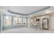 Open living space with a mini kitchen, bar seating, and tray ceilings at 3966 Creekview Ridge Dr, Buford, GA 30518