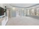 A spacious main bedroom with large windows and a tray ceiling at 3966 Creekview Ridge Dr, Buford, GA 30518