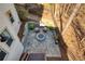 An aerial view of the backyard patio with a cozy stone firepit at 3966 Creekview Ridge Dr, Buford, GA 30518