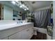Bathroom featuring a vanity, toilet, large mirror, and shower at 703 Cypress Pointe St, Alpharetta, GA 30022