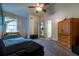 Bedroom featuring a wooden wardrobe, carpet, and natural light at 703 Cypress Pointe St, Alpharetta, GA 30022