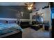 Bedroom featuring a bed, carpet, dark accent wall, and mirrored closet at 703 Cypress Pointe St, Alpharetta, GA 30022