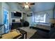 This bedroom features a flat screen television and carpeting at 703 Cypress Pointe St, Alpharetta, GA 30022