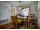 Cozy dining area with a glass-top table and a modern light fixture at 703 Cypress Pointe St, Alpharetta, GA 30022