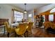 Bright dining area adjacent to the living room featuring stylish decor at 703 Cypress Pointe St, Alpharetta, GA 30022