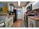 Kitchen with modern appliances, ample counter space, and direct access to the dining area at 703 Cypress Pointe St, Alpharetta, GA 30022