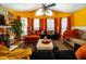 Spacious living room with vaulted ceilings, multiple windows, and stylish decor at 703 Cypress Pointe St, Alpharetta, GA 30022