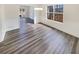 Inviting dining space with contemporary LVP flooring and natural light streaming through large windows at 1200 Platinum Dr, Hoschton, GA 30548