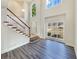 Grand two-story foyer with a staircase and large windows at 1200 Platinum Dr, Hoschton, GA 30548