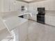 Bright kitchen featuring white cabinets, countertop and stainless steel appliances at 1200 Platinum Dr, Hoschton, GA 30548