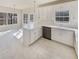 Spacious kitchen boasting white cabinets, an island and stainless steel appliances at 1200 Platinum Dr, Hoschton, GA 30548