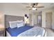 Calm bedroom with a plush bed, blue accents, and neutral walls at 1430 New Hope Church Rd, Loganville, GA 30052