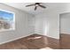 Cozy bedroom with hardwood floors, built-in shelves, and a ceiling fan at 1521 Bentcreek Dr, Marietta, GA 30062