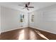 Bright bedroom featuring hardwood floors, ceiling fan, and natural light at 1521 Bentcreek Dr, Marietta, GA 30062