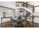 Dining room with dining table set, adjacent to a staircase with a modern railing and a chandelier at 1521 Bentcreek Dr, Marietta, GA 30062