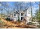 Beautiful two-story home with large windows, a screened-in porch, and manicured landscaping at 1521 Bentcreek Dr, Marietta, GA 30062