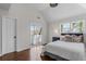 Bright main bedroom featuring hardwood floors, vaulted ceiling, and sliding glass door to a balcony at 1521 Bentcreek Dr, Marietta, GA 30062