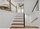 Modern staircase with wooden steps and metal railings leading to a bright, open space on the second floor at 1521 Bentcreek Dr, Marietta, GA 30062