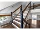 Beautiful staircase with wooden treads, modern railing, and natural light at 1521 Bentcreek Dr, Marietta, GA 30062