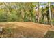 The spacious backyard is enclosed by a chain link fence and lush foliage at 2390 Morgan Ne Rd, Marietta, GA 30066
