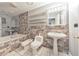 Bathroom features a unique tiled wall, a pedestal sink, tub, and bidet at 2390 Morgan Ne Rd, Marietta, GA 30066