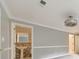 The bedroom features neutral gray walls, white trim, and a glimpse into an adjacent bathroom at 2390 Morgan Ne Rd, Marietta, GA 30066