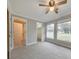 Bedroom showing ensuite bathroom and walk-in closet with ceiling fan overhead at 2390 Morgan Ne Rd, Marietta, GA 30066