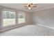 The bedroom showcases lots of light from the two windows and neutral gray walls at 2390 Morgan Ne Rd, Marietta, GA 30066