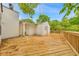 Wide shot of the deck with brown wood planks with foliage in the background at 2390 Morgan Ne Rd, Marietta, GA 30066