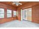 View of the wood paneled sunroom with a doorway leading inside at 2390 Morgan Ne Rd, Marietta, GA 30066