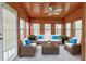 Bright sunroom with wood paneled ceiling and walls with lots of windows at 2390 Morgan Ne Rd, Marietta, GA 30066