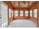 Cozy sunroom with wood-paneled ceiling and walls, plus natural light at 2390 Morgan Ne Rd, Marietta, GA 30066