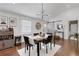 Bright dining area with hardwood floors and modern lighting fixture at 3096 Highland Se Dr, Smyrna, GA 30080