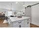 Bright kitchen featuring an island with seating, modern pendant lighting, and dining space for seamless entertaining at 3096 Highland Se Dr, Smyrna, GA 30080