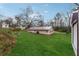 Aerial view of a home featuring a sprawling lawn and shed with metal roof at 555 N Lake N Dr, Covington, GA 30016