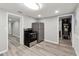 Kitchen featuring stainless steel appliances, white cabinets, granite countertops and new wood floors at 555 N Lake N Dr, Covington, GA 30016