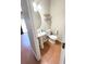 Stylish half bathroom with pedestal sink, wood floors, and modern fixtures at 5625 Jamerson Dr, South Fulton, GA 30349