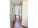 Long, bright hallway with hardwood floors and high ceilings at 5625 Jamerson Dr, South Fulton, GA 30349