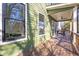 Relaxing back porch with wood floors, a ceiling fan, and views of the yard at 916 Ira Sw St, Atlanta, GA 30310