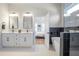 Elegant bathroom featuring double vanities, a soaking tub, and glass-enclosed shower with modern finishes at 916 Ira Sw St, Atlanta, GA 30310