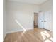 Bright bedroom featuring hardwood floors and a closet with black hardware, ideal for a modern, minimalist design at 916 Ira Sw St, Atlanta, GA 30310