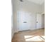 Room with hardwood flooring showcases tall ceilings and a closet with double doors at 916 Ira Sw St, Atlanta, GA 30310