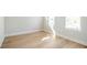 Bright bedroom with hardwood floors and natural light. Freshly painted white walls complement the light-colored flooring at 916 Ira Sw St, Atlanta, GA 30310