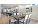 Bright dining room features a wooden table with seating for six, flowing into the kitchen and living area at 916 Ira Sw St, Atlanta, GA 30310