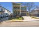 Modern two-story home with green siding, brick accents, and a two-car garage at 916 Ira Sw St, Atlanta, GA 30310