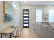 Bright foyer featuring modern front door, hardwood floors, and stylish console table at 916 Ira Sw St, Atlanta, GA 30310