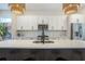 Bright kitchen featuring a large island, stainless steel appliances, and pendant lighting at 916 Ira Sw St, Atlanta, GA 30310